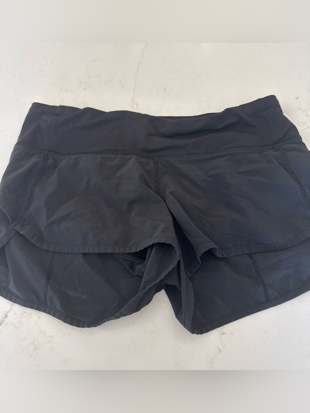 Lululemon speed up short. Solid black. Size 4. EUC.